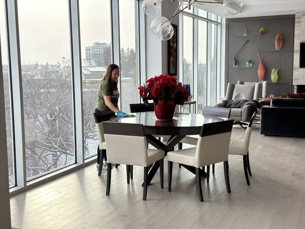 an image of a woman who is cleaning the table